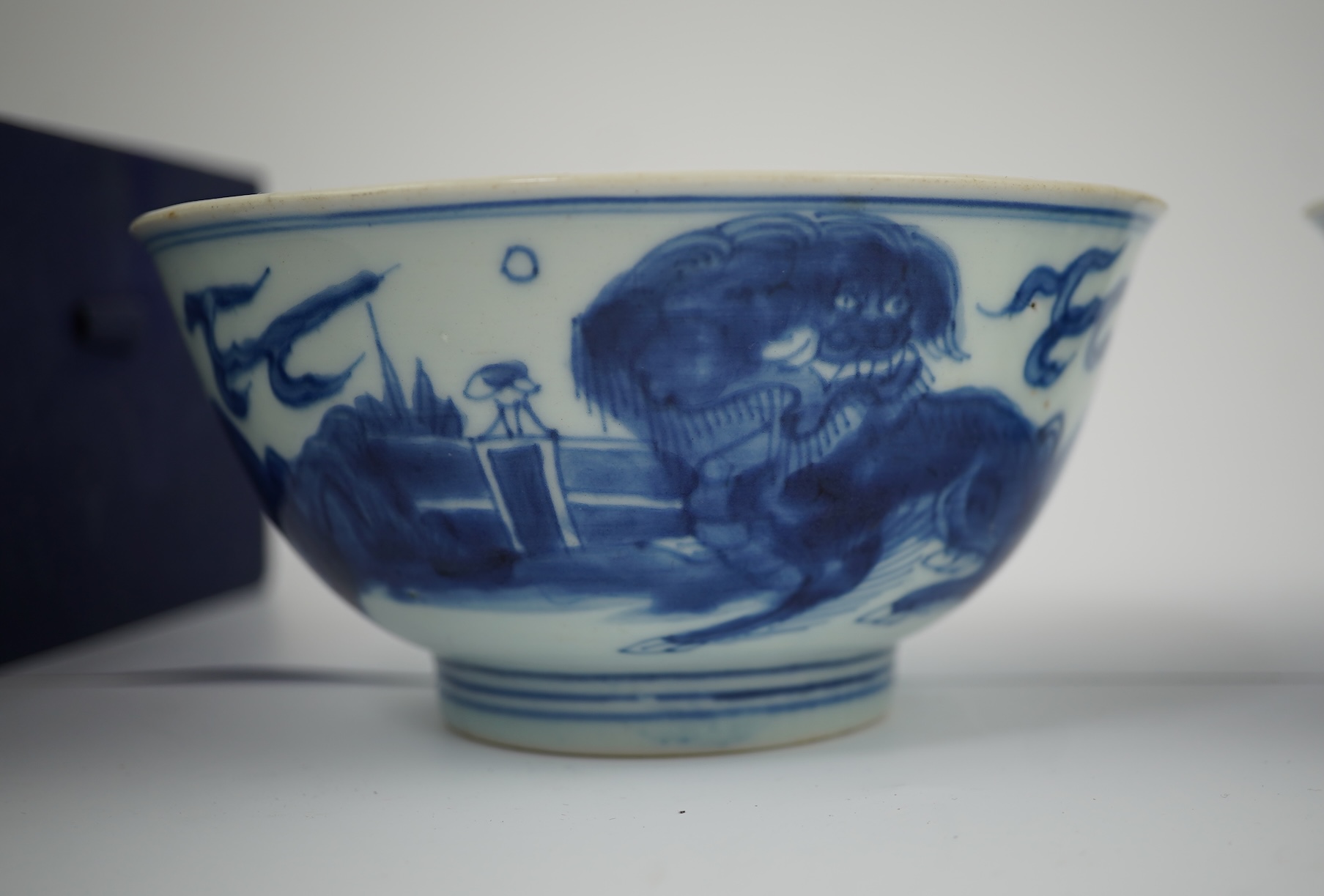 A pair of Chinese Transitional blue and white 'mythical beasts' bowls, early Kangxi period